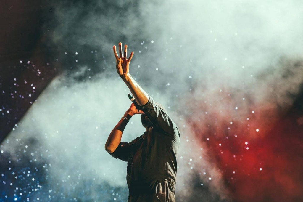 musician singing on stage